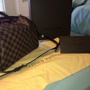 Louis Vuitton ‘speedy’ purse with extended strap.